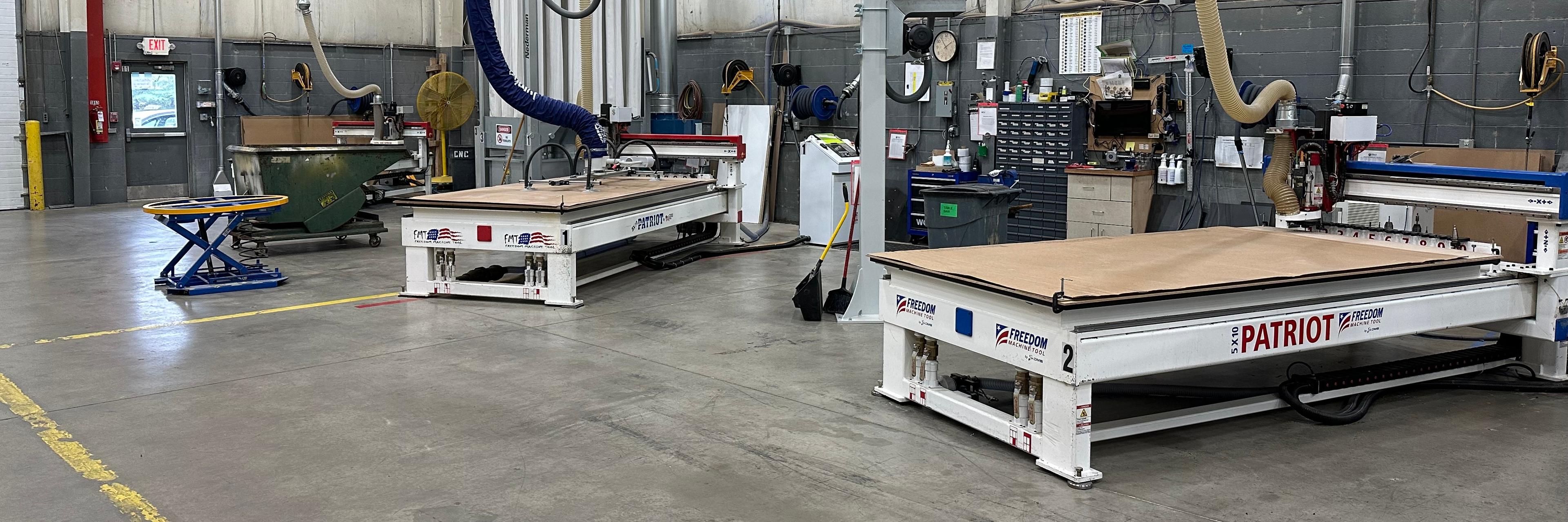 Two CNC routers in a shop